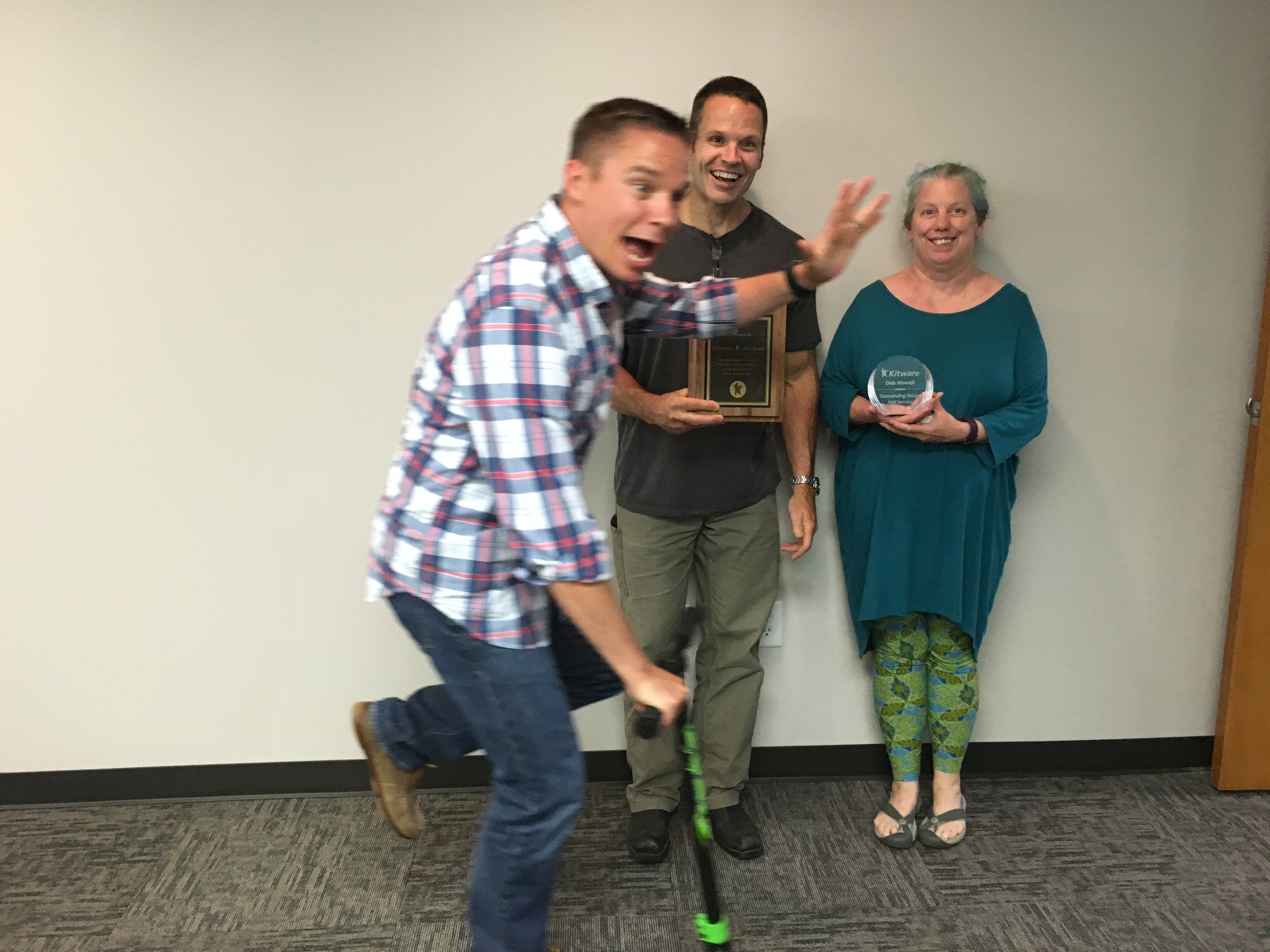 Brad Davis (left), Stephen Aylward (center), and Deb Howell (right) celebrate the Carrboro office anniversary.