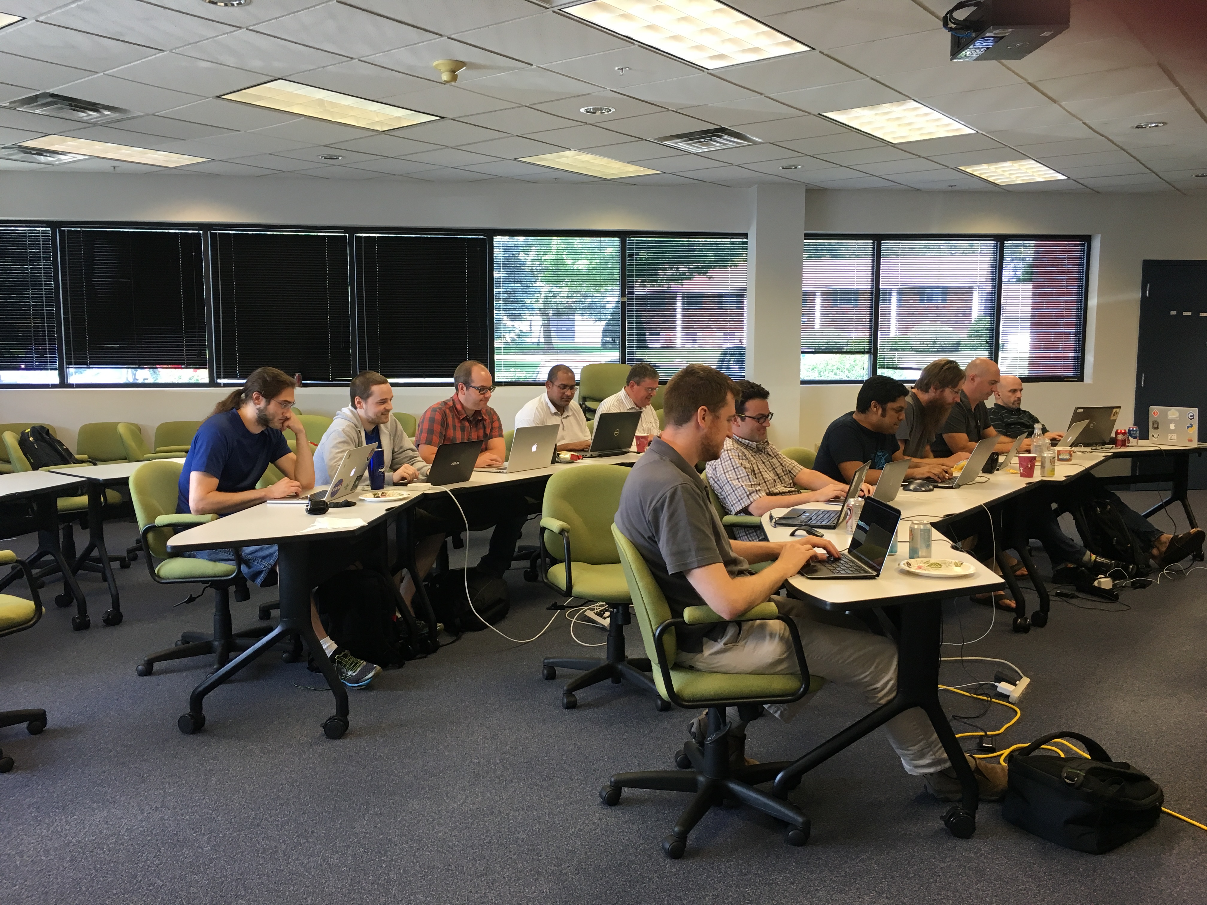 Participants in Clifton Park, New York, work to make improvements to Girder during the hackfest.