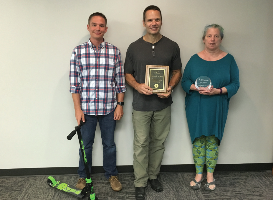 Brad Davis, Stephen Aylward, and Deb Howell receive recognition at a celebration in Carrboro, North Carolina.