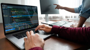 Two people learning at a computer.
