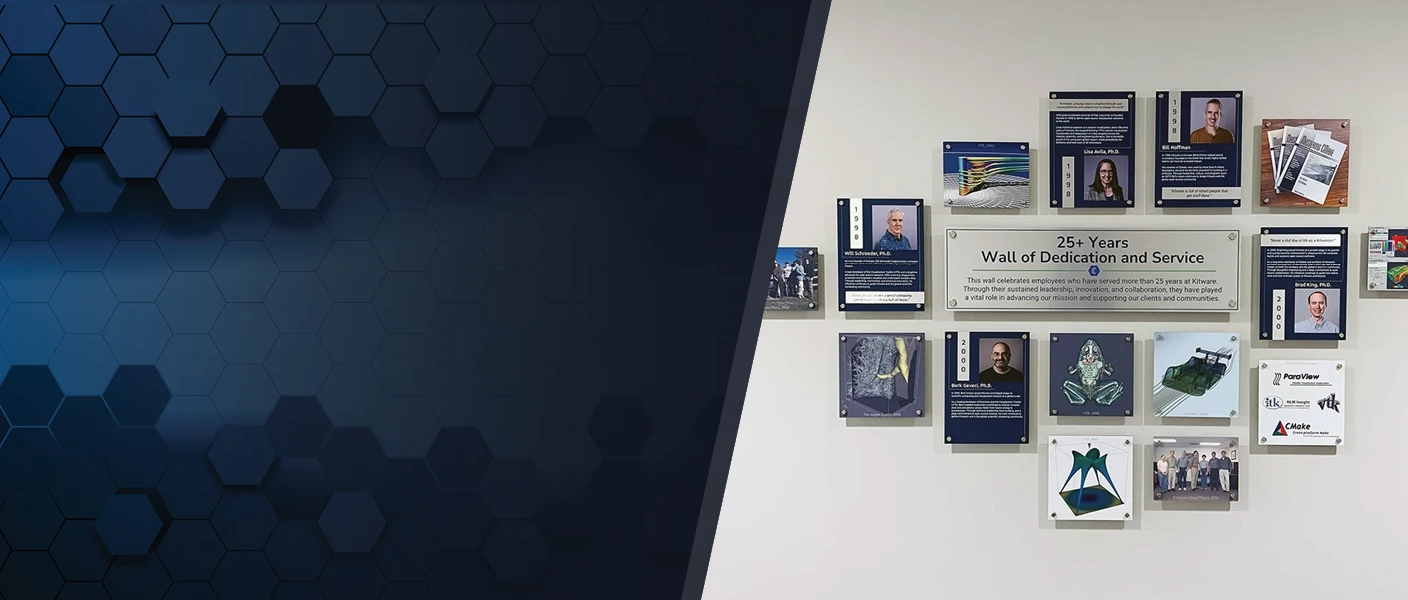 A company wall display titled "25+ Years Wall of Dedication and Service" honoring long-tenured Kitware employees with photos, plaque highlights, and project logos, set alongside a dark blue geometric hexagon pattern background.